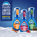 Three Dawn Powerwash spray bottles styled on snowy surface showing limited-edition pumpkin spice, cranberry, and pine variants