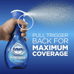 Hand holding Dawn Platinum Powerwash bottle spraying fine mist with instruction text about pulling the trigger for coverage.