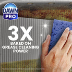 Hand using a blue sponge to scrub a greasy metal surface with Dawn Pro logo and '3X baked on grease cleaning power' text
