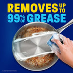 Overhead view of a frying pan being scrubbed with a sponge and the bold text 'Removes up to 99% of grease' on a blue background.