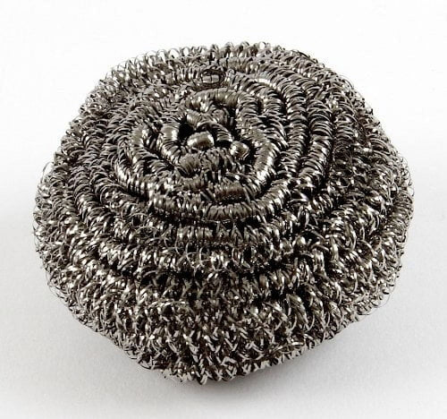 Close-up of a single coiled stainless steel kitchen scourer scrubber on a white background
