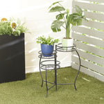 Black metal three-tier plant stand shown outdoors with potted plants on each circular starburst shelf.