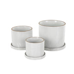 Angled view of three DecMode white ceramic planters with grid texture and brown rims, each on a matching saucer on a white background