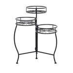 Black three-tier metal plant stand with starburst wire shelves and curved legs on white background.