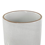 Close-up of a white DecMode ceramic planter showing grid texture on the exterior and a brown rim at the top