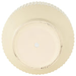 Top-down view of a cream ribbed ceramic planter showing circular base and drainage plug at center.