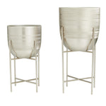 Front view of two brushed silver dome planters with removable metal stands on white background