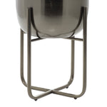 Close-up view of the lower half of a DecMode metal planter seated in its removable metal stand on white background