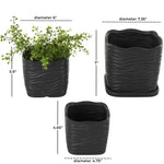 Studio image of three black wavy-ribbed ceramic planters with dimension lines and measurements