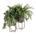 Pair of DecMode metal planters with stands filled with leafy green plants against a white background
