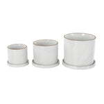 Three white DecMode ceramic planters in small, medium, and large sizes, each seated on its matching round saucer against a white background