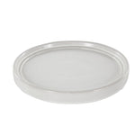 Round white ceramic saucer with a raised outer edge and subtle speckle glaze, matching DecMode planter set