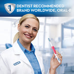 Smiling dental professional holding a pink Oral-B battery toothbrush with a dentist-recommended banner
