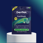 Product-style shot of DenTek Fresh Breath pouch standing on a white podium against teal background