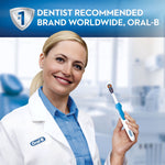 Smiling dentist in lab coat holding an Oral-B 3D White toothbrush with endorsement banner above