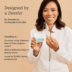 Portrait of a smiling dentist holding a COCOLAB Cocofloss refill spool with product text and credentials beside her