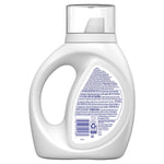 Rear view of a white detergent bottle showing back label text, barcode and safety/recycling icons