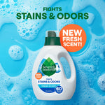 Seventh Generation Fresh Scent detergent bottle against a blue soapy background with 'New Fresh Scent' badge