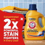 Yellow detergent bottle next to folded laundry with red panel stating 'Concentrated with 2x Powerful Stain Fighters'.