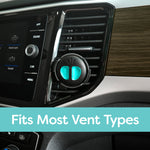 Refresh Your Car mini diffuser clipped to a vehicle air vent showing teal scent insert and dashboard area