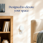 Styled room scene showing a Scent Theory diffuser plugged into a wall outlet next to shelving and sofa with headline 'Designed to elevate your space'.