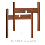 Disassembled view of antique mahogany wooden plant stand pieces laid out with a screw and 'pot not included' text