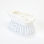 White Dish Daddy brush head shown from an angle highlighting the attachment channel and evenly trimmed nylon bristles.