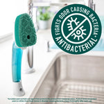 Dishwand scrub head attached to a handle near a sink with antibacterial badge reading fights odor causing bacteria
