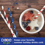 Top-down view of a cold drink in a Dixie cup with red, white and blue straws and star-shaped fruit garnish