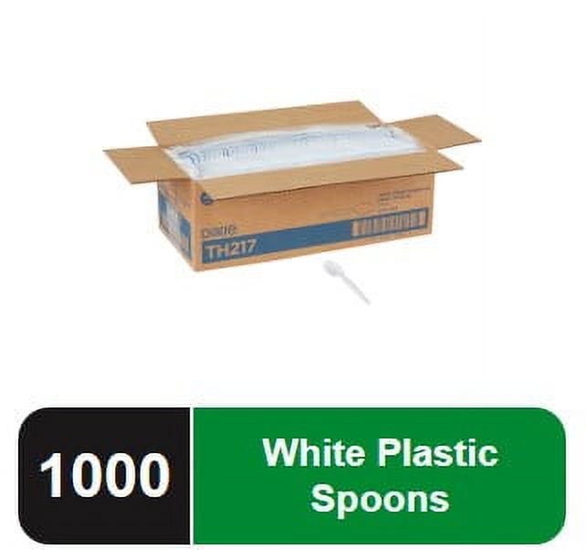Open cardboard case of disposable white spoons with one spoon shown and a green/black label reading '1000 White Plastic Spoons'
