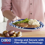 Person holding Dixie Ultra 10" blue-swirl paper plate with steak, mashed potatoes and asparagus