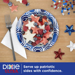 Dixie Ultra blue patterned paper bowl filled with star-shaped fruit and berries on a wooden table