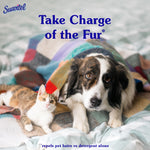A dog and a cat lying under a colorful blanket on a bed with overlay text 'Take Charge of the Fur' and Suavitel logo
