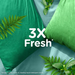 Green pillows and botanical leaves with text stating 3X Fresh against a soft green backdrop