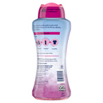 Back view of a Downy April Fresh scent booster bottle showing usage instructions, ingredients panel and barcode