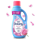 Blue Downy April Fresh liquid fabric softener bottle with pink cap, rose petals and a pink rose accent