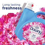 Close-up of Downy April Fresh bottle cap and label surrounded by bright pink flowers and ‘long lasting freshness’ text