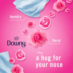 Pink Downy-themed graphic with roses and fabric imagery describing a floral laundry scent for Febreze collaboration