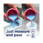 Hands pouring blue liquid fabric softener from a pink cap into washer dispenser and filler showing two pour options