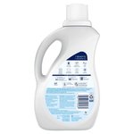 Rear view of a white Downy bottle showing the back label with ingredients, barcode and a '7 benefits' icon panel.