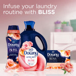 Promotional grouping of Downy products including in-wash scent booster, liquid fabric softener, and Bliss dryer sheets