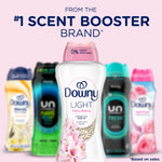 Downy Light Cherry Blossom bottle in front with other scent booster bottles blurred and '#1 scent booster' headline.