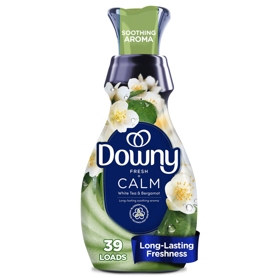 Close-up of a Downy Calm fabric softener bottle with white floral graphics and branding on white background