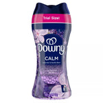 Tall purple Downy CALM laundry scent booster bottle showing lavender and vanilla bean imagery and visible beads inside the package