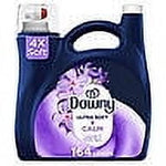 Front of a Downy Calm lavender and vanilla bean liquid fabric softener jug with purple label and built-in handle.