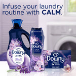 Staged product group featuring Downy Calm bottle, fabric softener jug, and sheet box with laundry room background.