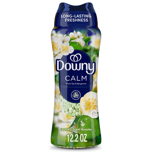 Tall bottle of Downy Calm laundry scent booster with floral graphics and visible green scent beads