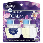 Front retail blister pack of Downy Infusions Febreze Plug Calm oil refills showing two clear refill bottles with blue and purple caps and lavender artwork.