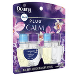 Downy Infusions Febreze Plug Calm packaged oil refills with lavender and vanilla bean label, two clear bottles with blue and purple caps on floral background.