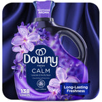 Close-up product label of a purple Downy Fresh Calm fabric softener bottle with lavender flowers